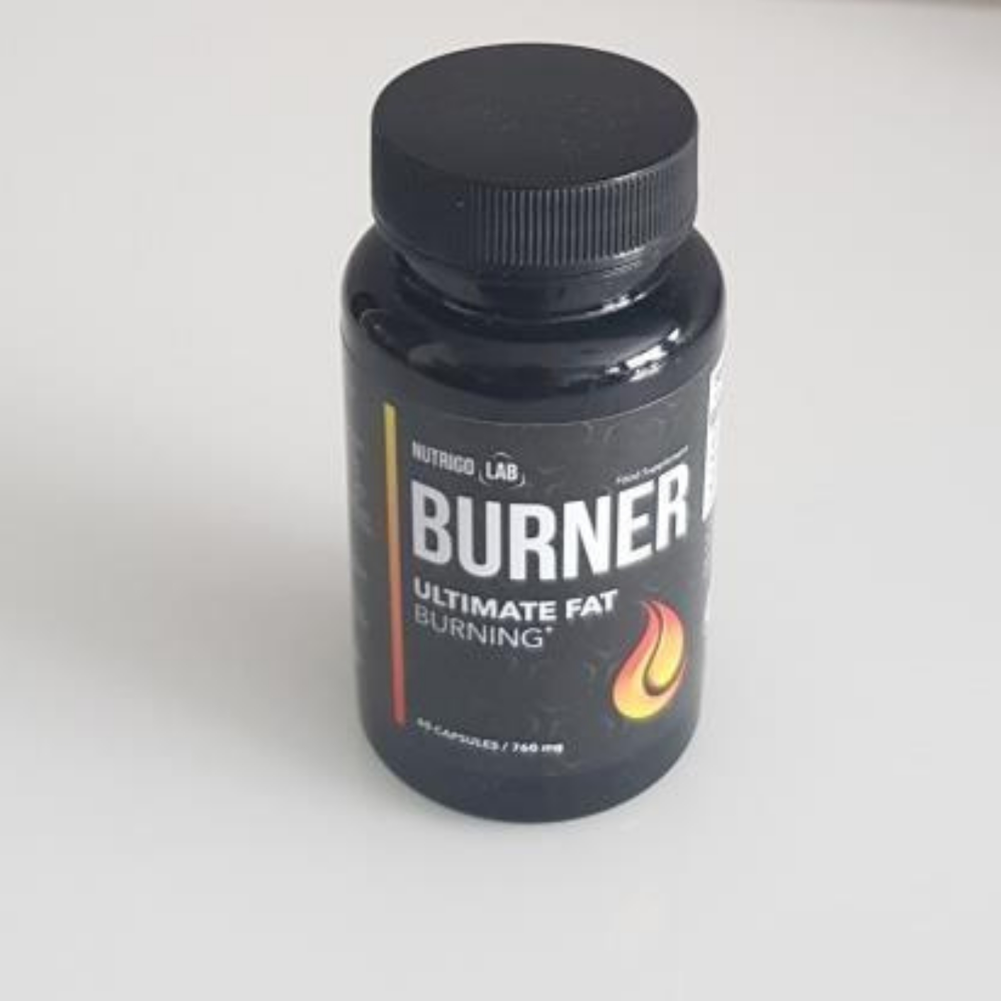 nutrigo lab thermogenic fat burner Nutrigo Lab Burner black bottle with flame icon, showcasing a powerful thermogenic fat burner for athletes and advanced weight loss.