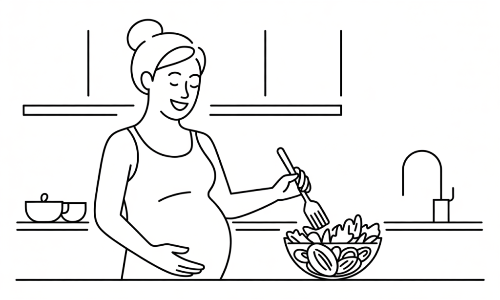 Smiling pregnant mother preparing a healthy salad in a kitchen.