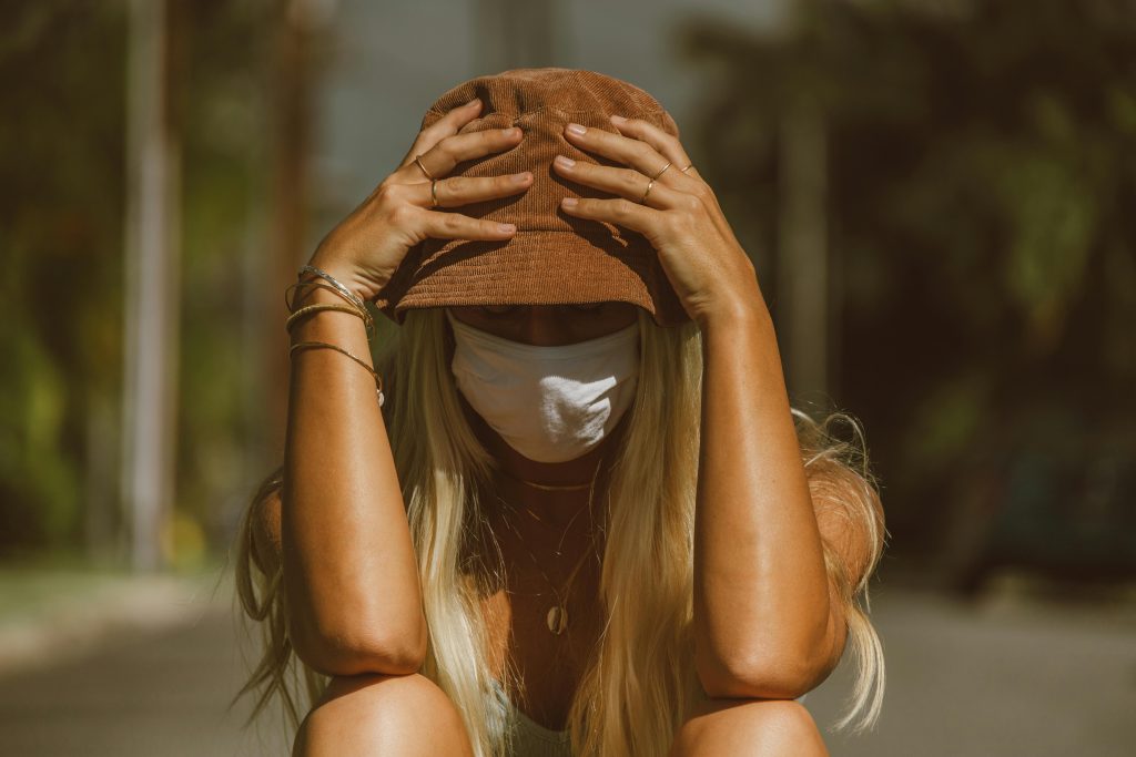 7 Proven Ways to Stop Hair Thinning Fast Naturally Woman wearing protective sun hat outdoors demonstrating UV protection for hair health